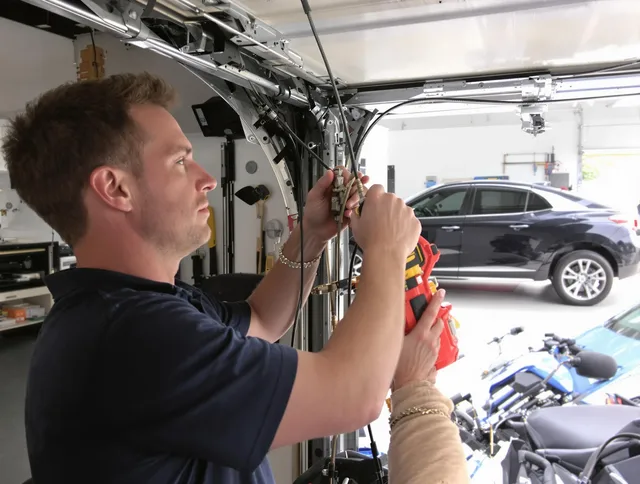 Deerfield Beach Garage Door Repair safety certified technician performing cable replacement in Deerfield Beach