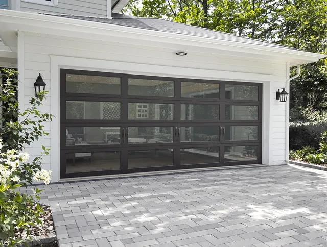 Deerfield Beach Garage Door Repair design specialist presenting custom garage door options to Deerfield Beach homeowner