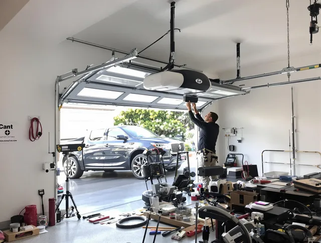 Deerfield Beach Garage Door Repair specialist installing smart garage door opener system in Deerfield Beach home