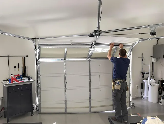 Deerfield Beach Garage Door Repair specialist performing precise section replacement on Deerfield Beach garage door